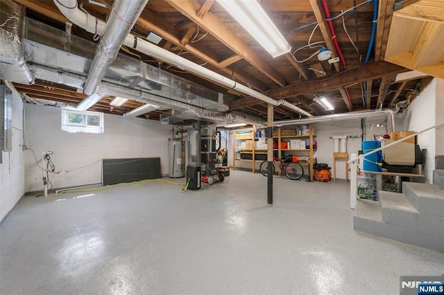 basement with water heater and stairway