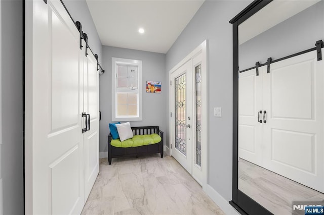 mudroom with baseboards, a barn door, marble finish floor, and recessed lighting