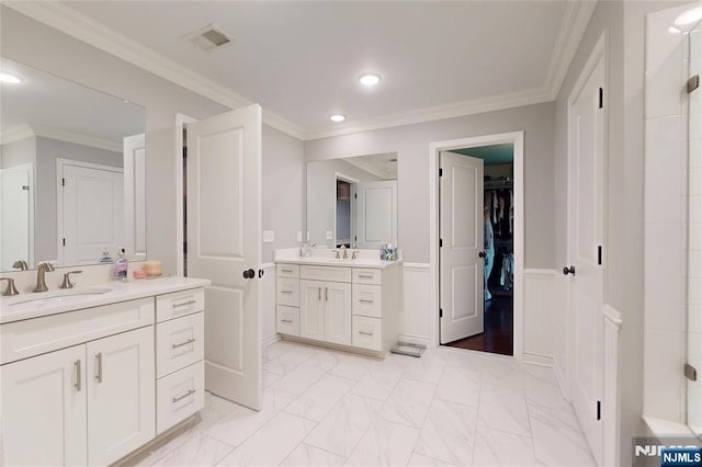 16 Marilyn Dr, Woodcliff Lake, NJ 07677 - bathroom featuring two vanities, recessed lighting, ornamental molding, marble finish floors, and a spacious closet