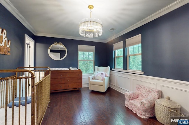 16 Marilyn Dr, Woodcliff Lake, NJ 07677 - bedroom with a chandelier, hardwood / wood-style floors, crown molding, a wainscoted wall, and a decorative wall
