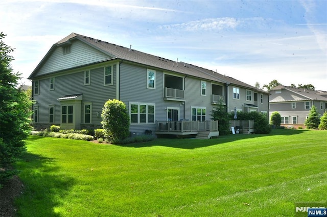 16 Marilyn Dr, Woodcliff Lake, NJ 07677 - back of property with a lawn, a wooden deck, and a residential view