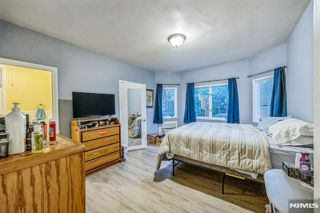 bedroom with light wood finished floors
