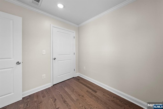 165 Jerome Pl, Bloomfield, NJ 07003 - spare room featuring visible vents, crown molding, baseboards, and dark wood-type flooring