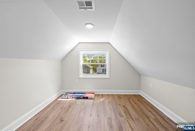 165 Jerome Pl, Bloomfield, NJ 07003 - additional living space featuring visible vents, baseboards, lofted ceiling, and wood finished floors