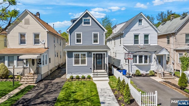 165 Jerome Pl, Bloomfield, NJ 07003 - view of front facade with fence and aphalt driveway