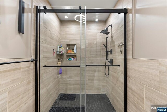 bathroom with a shower stall