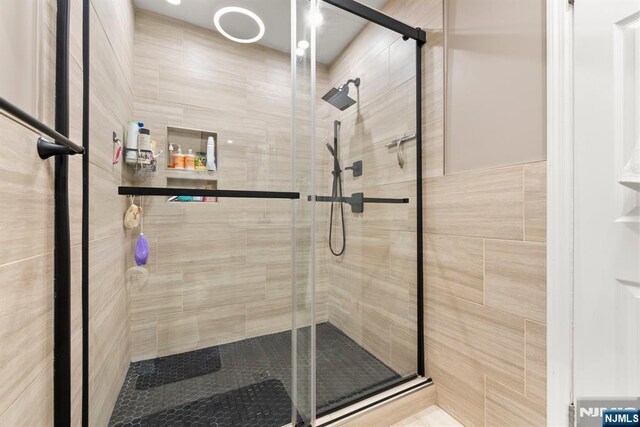 full bathroom with a shower stall