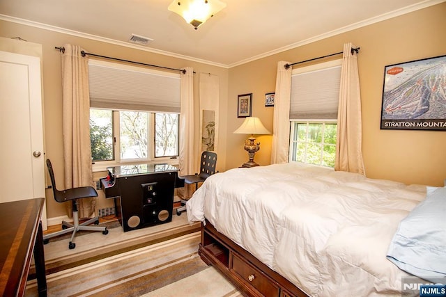 bedroom with crown molding and visible vents