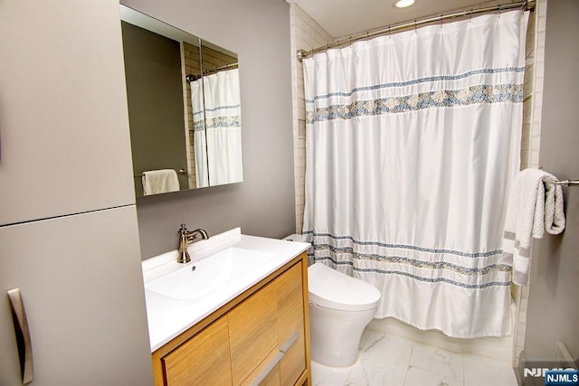 bathroom with vanity, toilet, a shower with shower curtain, and marble finish floor