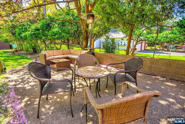 view of patio / terrace featuring fence and an outdoor living space