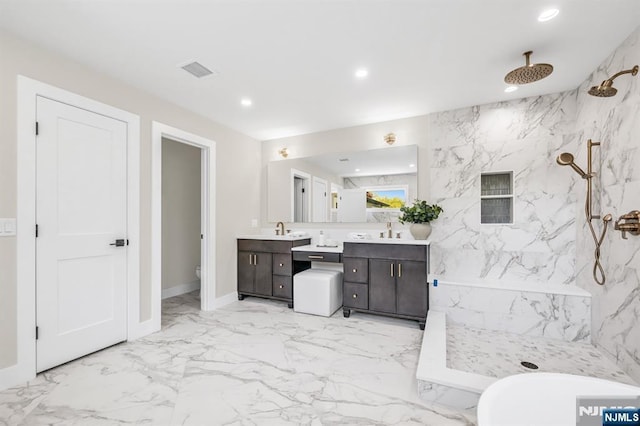 bathroom featuring visible vents, vanity, toilet, marble finish floor, and a marble finish shower