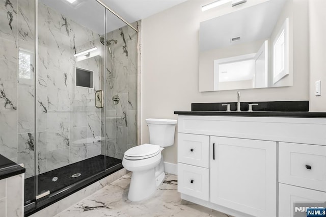 bathroom featuring visible vents, vanity, toilet, marble finish floor, and a marble finish shower