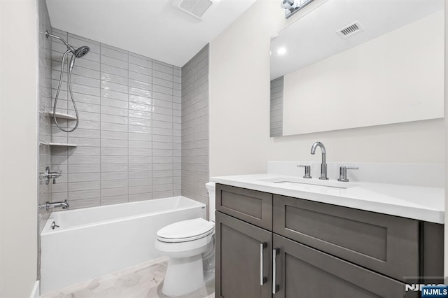 bathroom with visible vents, marble finish floor, toilet, and vanity