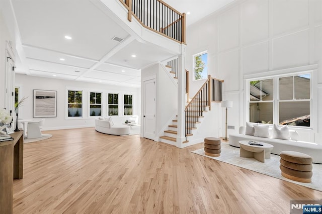 entryway featuring stairs, recessed lighting, and wood finished floors