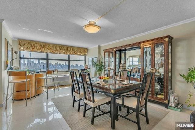 dining space featuring crown molding, a textured ceiling, and a healthy amount of sunlight