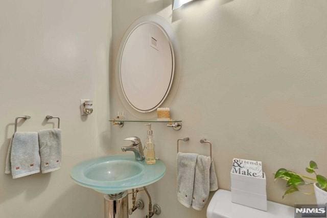 bathroom with a sink and toilet