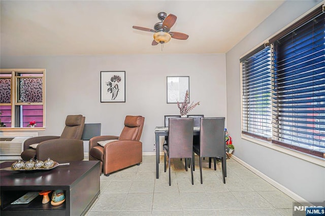 dining room with light tile patterned floors, ceiling fan, and baseboards