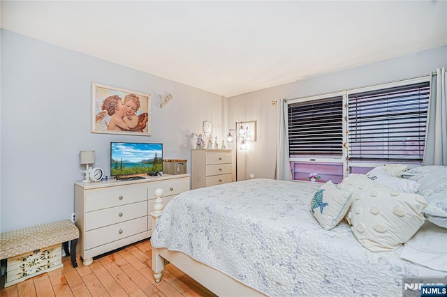 bedroom featuring light wood finished floors