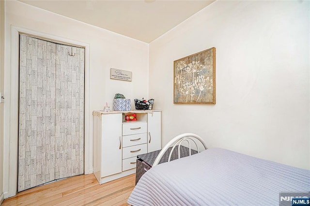 bedroom featuring light wood-style flooring