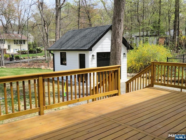 wooden deck with an outdoor structure