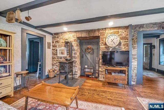 2 Wierimus Ln, Hillsdale, NJ 07642 - living room featuring wood finished floors, a wood stove, and beam ceiling
