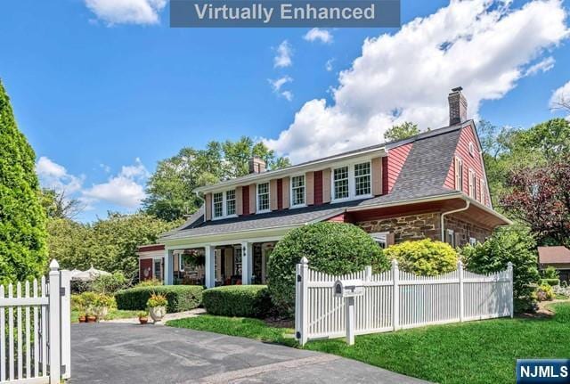 2 Wierimus Ln, Hillsdale, NJ 07642 - view of front of property with fence, a chimney, and stone siding
