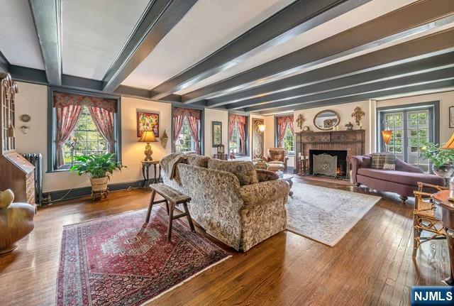 2 Wierimus Ln, Hillsdale, NJ 07642 - living room featuring plenty of natural light, beam ceiling, and wood finished floors