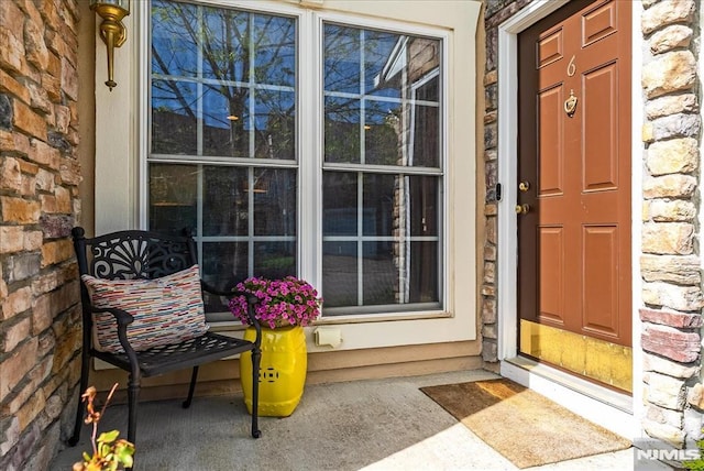 view of exterior entry with stone siding