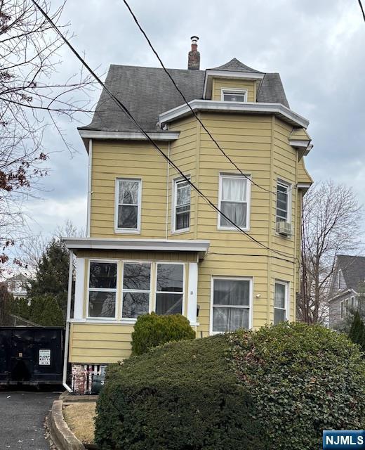 1 Reid Ave, Passaic, NJ 07055 - view of front of home with a chimney