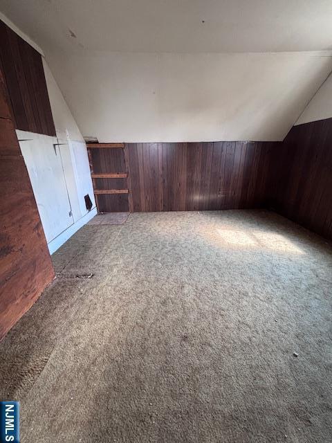 1 Reid Ave, Passaic, NJ 07055 - additional living space with wooden walls, carpet floors, and lofted ceiling