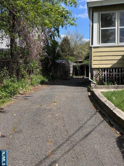 1 Reid Ave, Passaic, NJ 07055 - view of side of property with fence and driveway