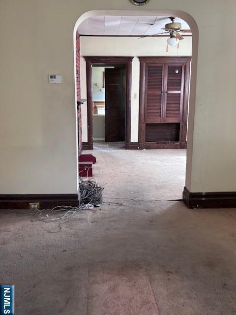 1 Reid Ave, Passaic, NJ 07055 - hallway featuring carpet flooring, arched walkways, and baseboards