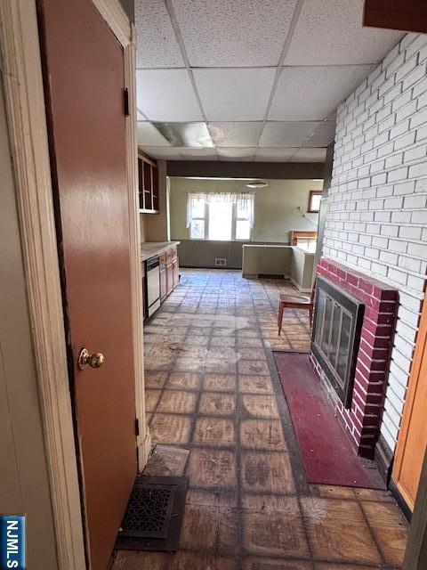 1 Reid Ave, Passaic, NJ 07055 - unfurnished living room with a drop ceiling and a fireplace