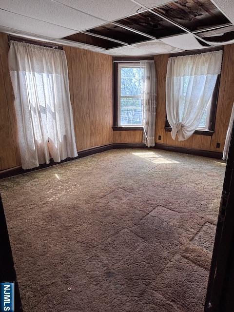 1 Reid Ave, Passaic, NJ 07055 - carpeted spare room featuring wood walls