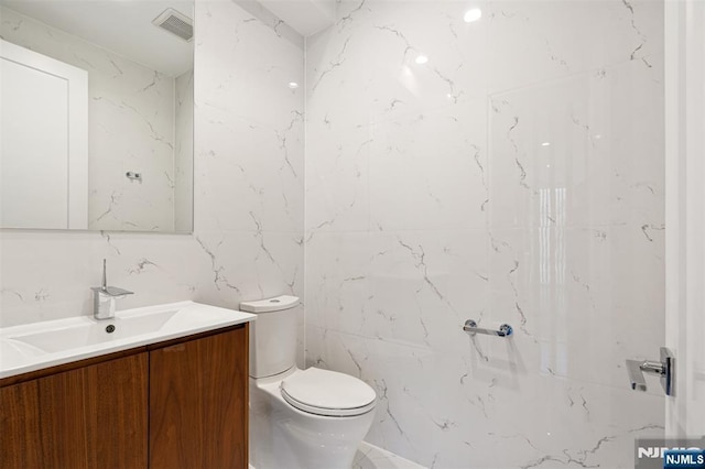 5-05 Washington Pl Unit 5-05, Cliffside Park, NJ 07010 - bathroom with vanity, toilet, tile walls, and visible vents