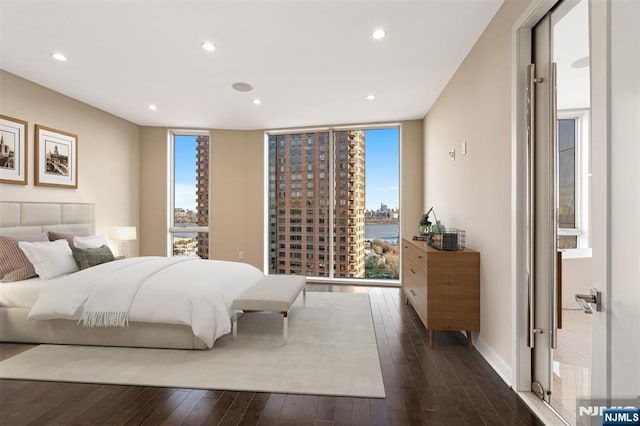 5-05 Washington Pl Unit 5-05, Cliffside Park, NJ 07010 - bedroom with recessed lighting, dark wood-style flooring, and expansive windows