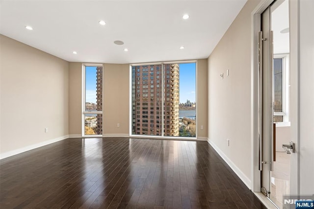 5-05 Washington Pl Unit 5-05, Cliffside Park, NJ 07010 - empty room featuring a healthy amount of sunlight, wood-type flooring, and recessed lighting
