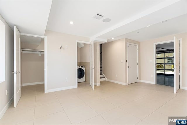 5-05 Washington Pl Unit 5-05, Cliffside Park, NJ 07010 - unfurnished bedroom featuring baseboards, washer / clothes dryer, recessed lighting, a spacious closet, and light tile patterned floors