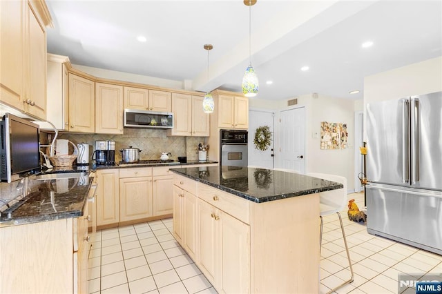 kitchen with light tile patterned flooring, appliances with stainless steel finishes, beam ceiling, light brown cabinets, and backsplash
