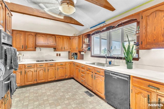 kitchen featuring brown cabinetry, visible vents, a sink, lofted ceiling, and black dishwasher