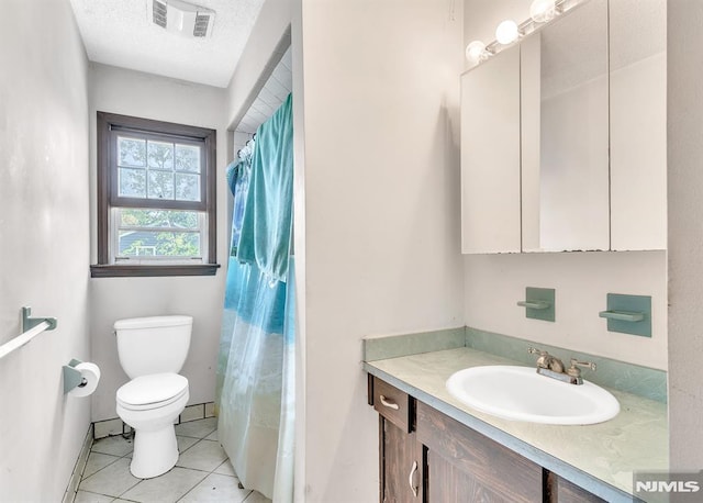 bathroom with tile patterned flooring, vanity, toilet, a shower with shower curtain, and visible vents