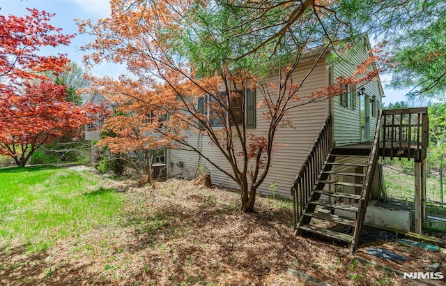 exterior space featuring a deck and stairway