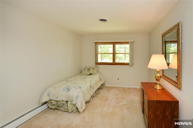 carpeted bedroom featuring visible vents, baseboards, and baseboard heating