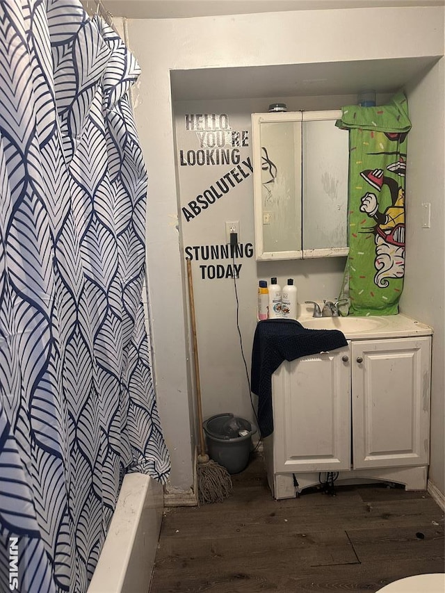 bathroom with wood finished floors, vanity, toilet, and a shower with shower curtain