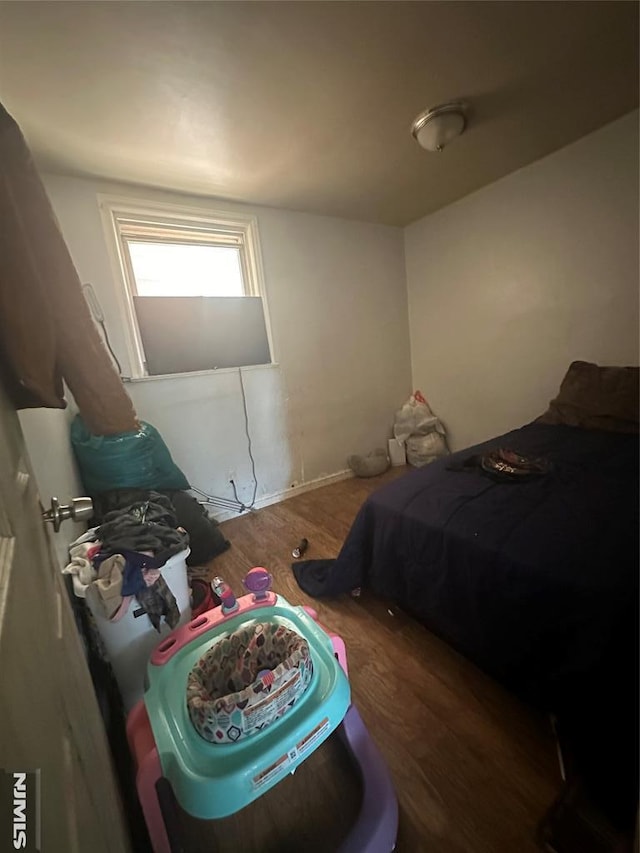 bedroom with wood finished floors