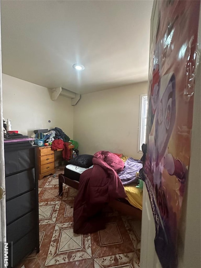 tiled bedroom featuring recessed lighting