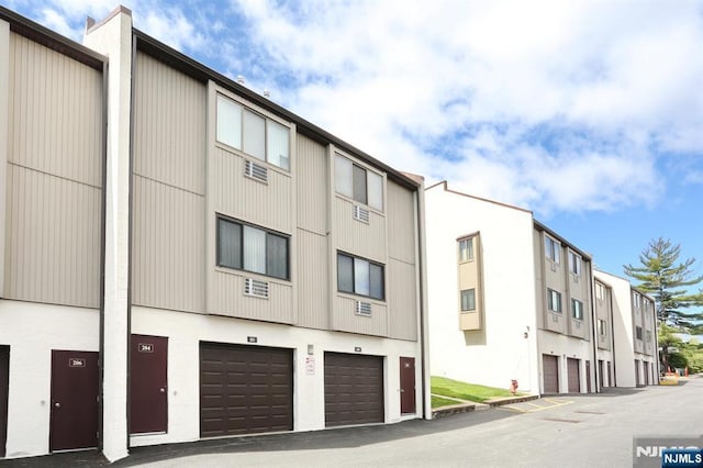 view of building exterior with a garage