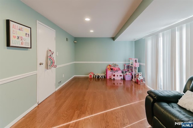game room featuring visible vents, recessed lighting, baseboards, and wood finished floors