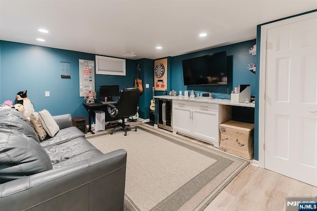 home office with recessed lighting and light wood finished floors