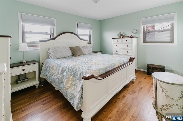 bedroom featuring wood finished floors